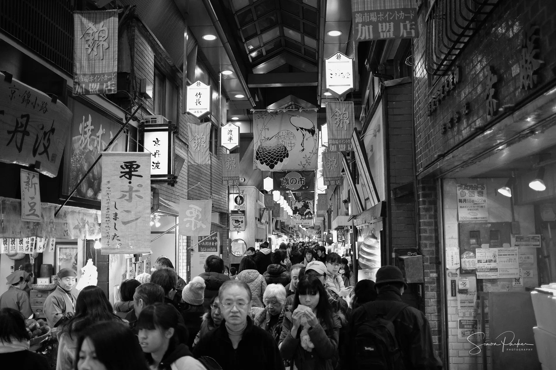 A crowded market street at night in Japan